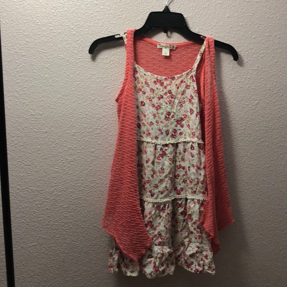 A dress with a light jacket overtop